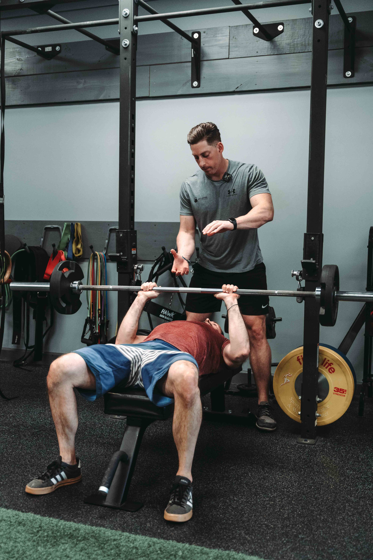 Bench Press - Man Doing Bench Press With Personal Trainer