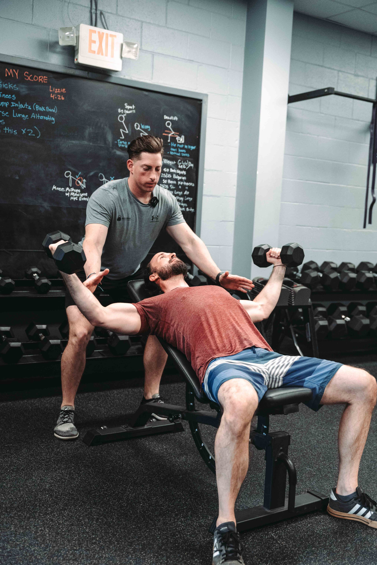 Dumbbell Fly - Man Doing Dumbbell Flys With Personal Trainer