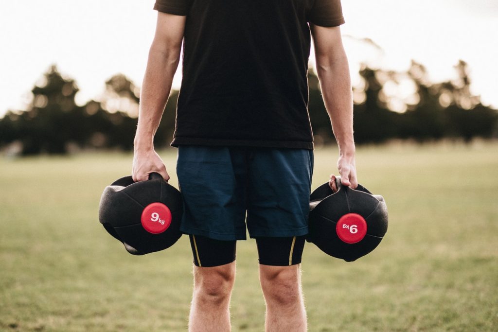 Man Standing With Dumbbells for Personal Training in Wilmington NC