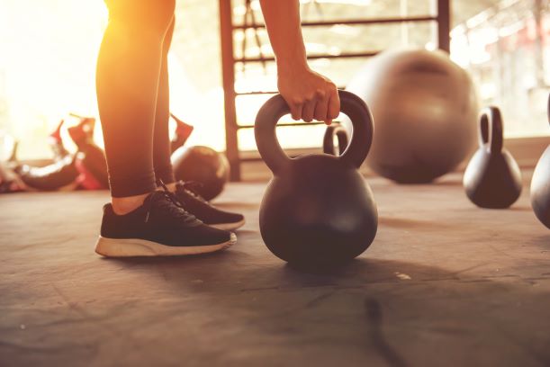 Woman Using Kettle Bell